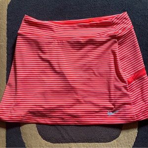 Nike DRI-FIT striped golf skirt. The skirt is in really good condition. New.